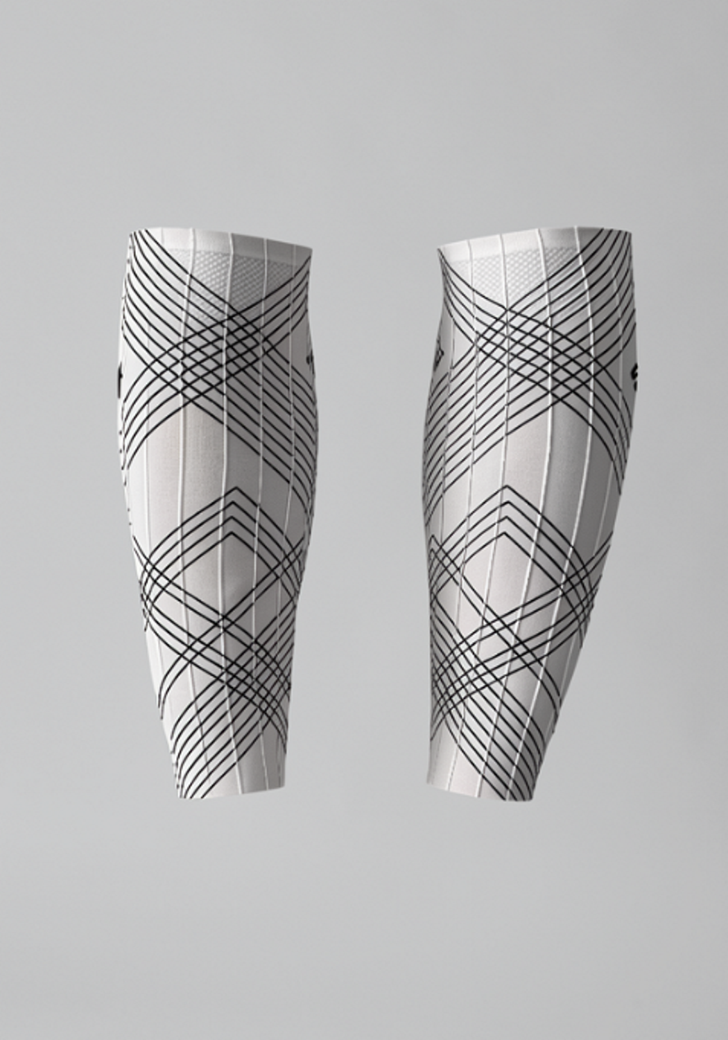 White cycling leg sleeves with black geometric line patterns on a plain background