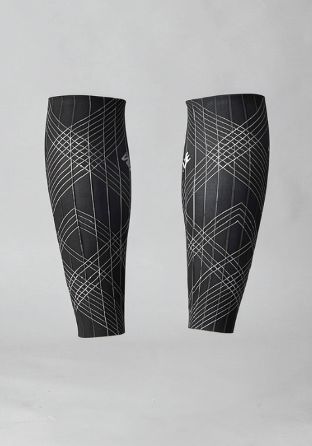 Black cycling leg warmers with white geometric pattern, isolated on grey background